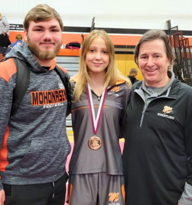 Student wrestler with her coach