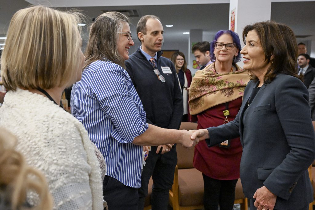 Teachers shaking hands with Governor Hochul