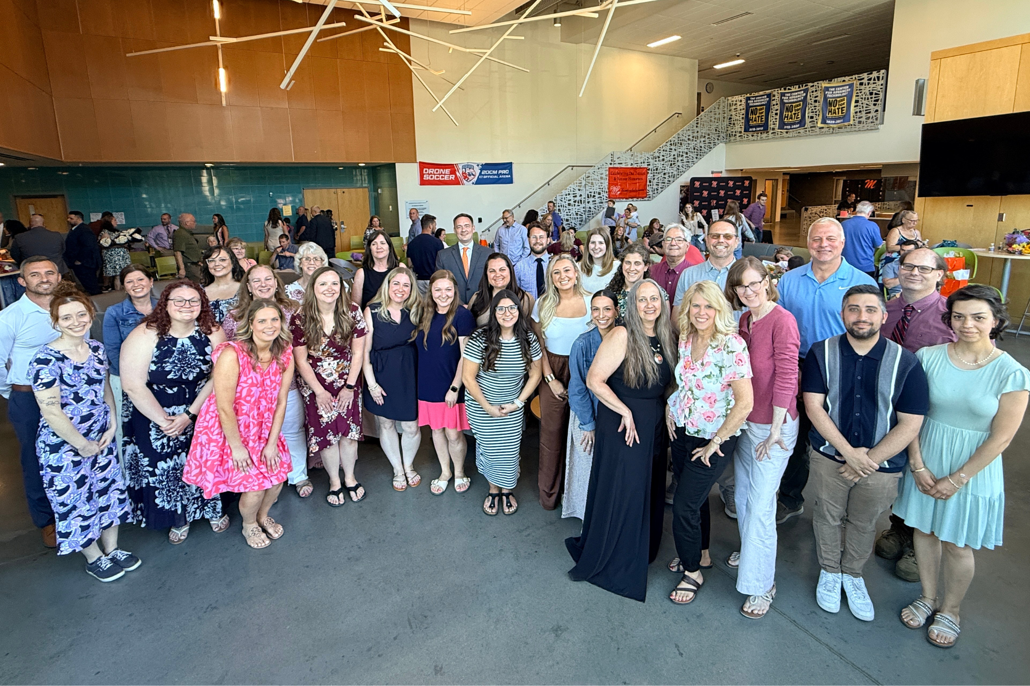Group of teachers posing for a Retirement and Tenure Reception