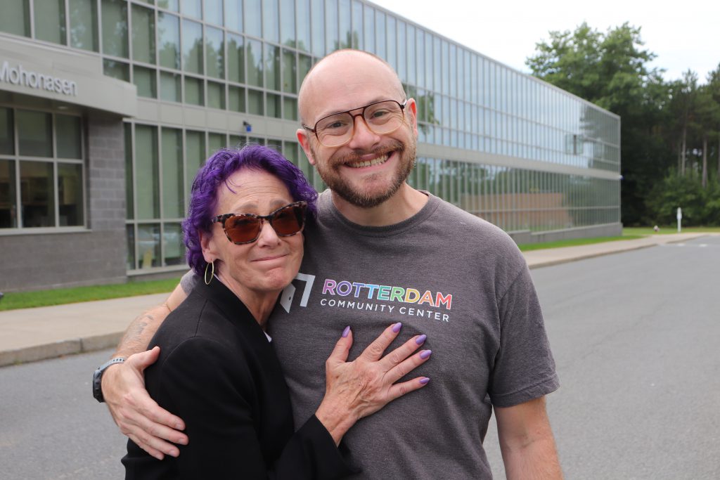 Two adults hugging